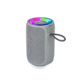 Portable Bluetooth speaker with RGB light ring and carrying strap, ideal for outdoor use