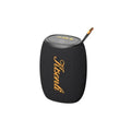 Black portable Bluetooth speaker with gold logo and control buttons, compact wireless audio device