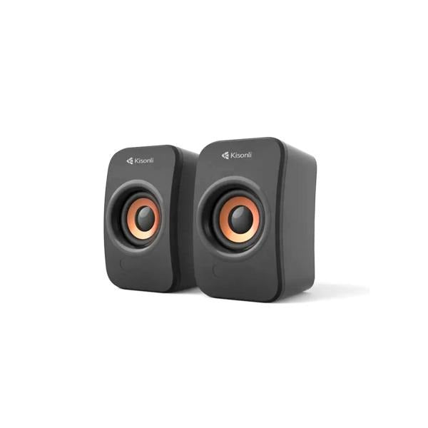 Compact black desktop speakers with copper drivers, ideal for computer audio and home office setups